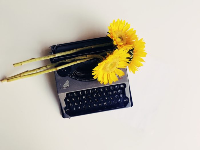 Typewriter with sunflowers