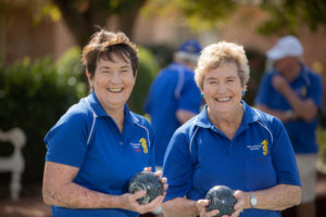 Del with sister Evon playing lawn bowls