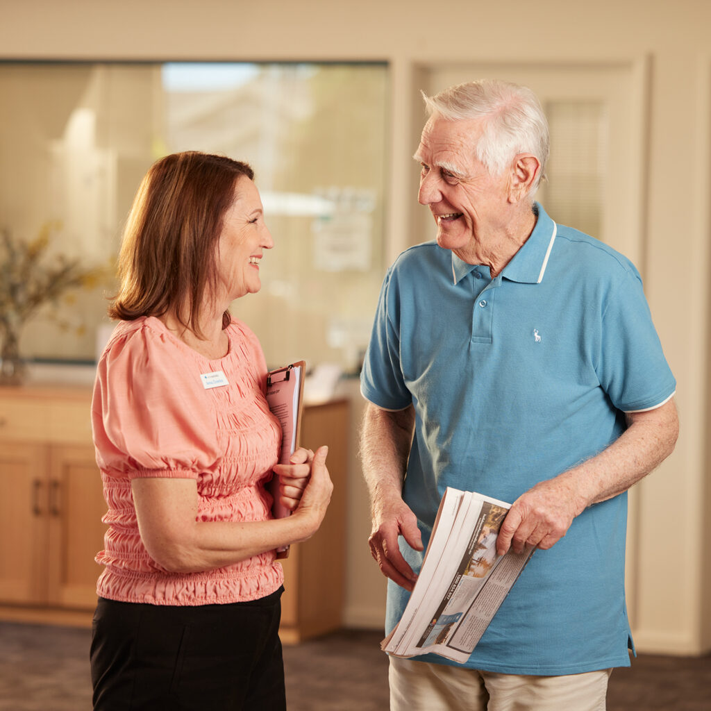 Resident and a ReitreAustralia employee talking